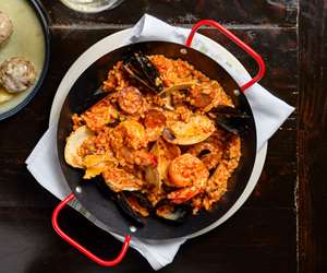 Greca's signature paella, with shrimp, mussels, clams, loukaniko and steak