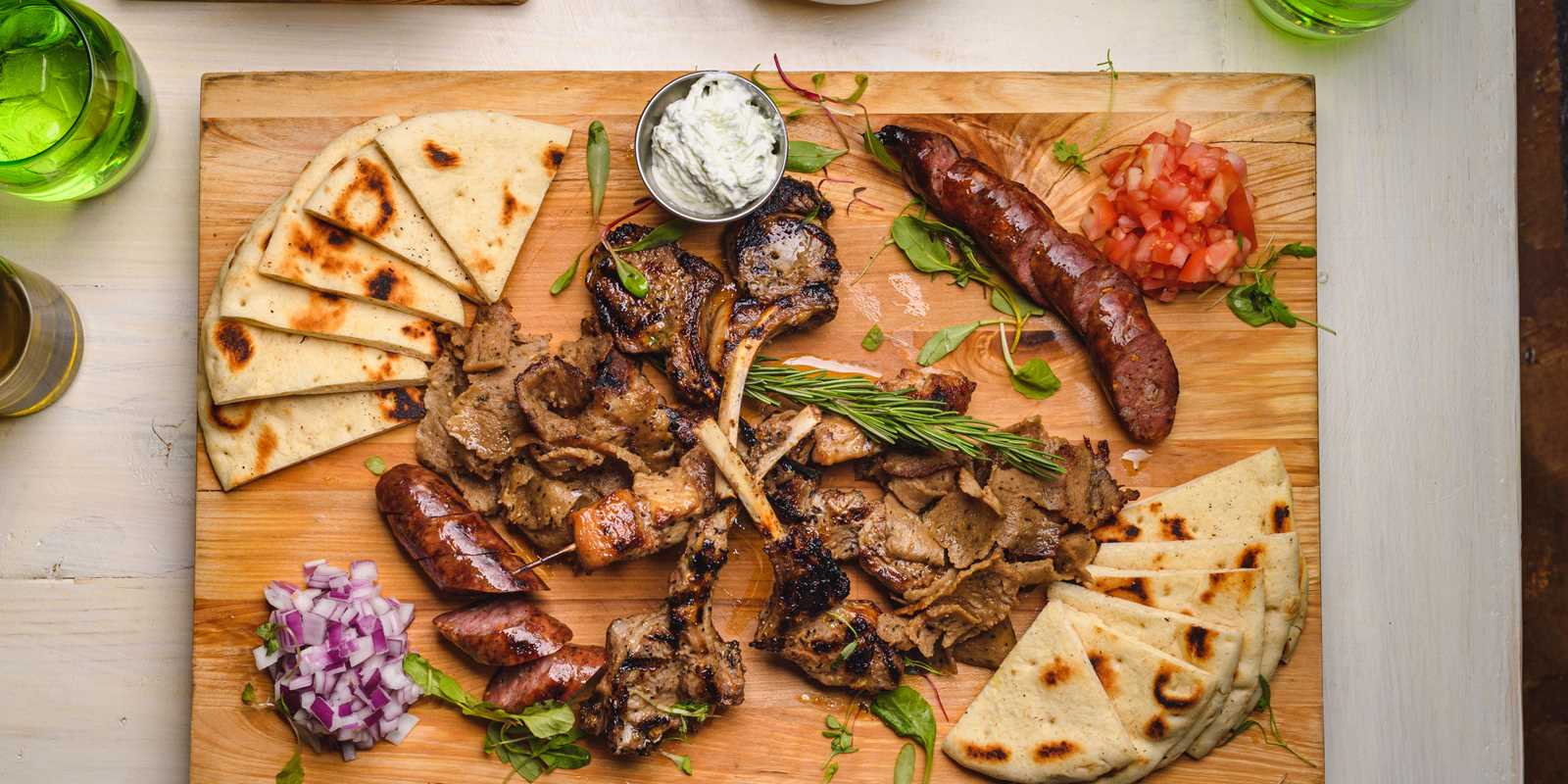 The Mediterranean Grille: Lollipop lamb chops, chicken skewers, gyro carvings and loukaniko (traditional village sausage).