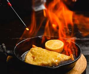 Saganaki: Kefalograviera cheese, tempura battered and gently fried. Served flambe.